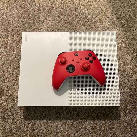Xbox one including many games on it like Fortnite 2k and madden 23 and more.